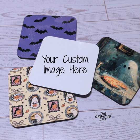 Four Halloween-themed coasters on a wooden surface with a customizable card in the center.